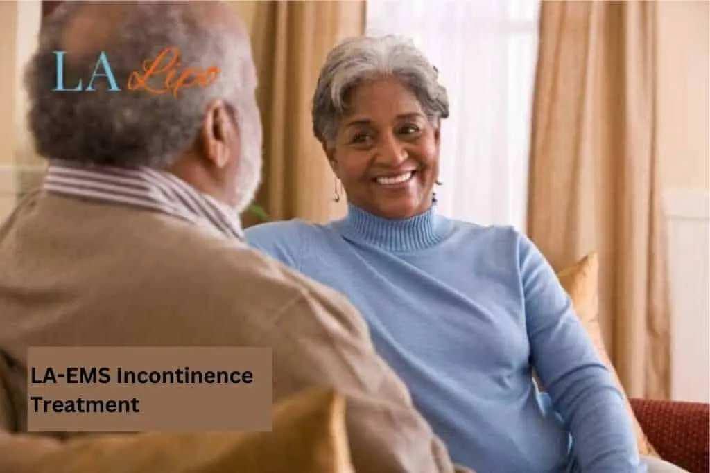 Couple sat smiling at each other - LA-EMS treatment Nantwich